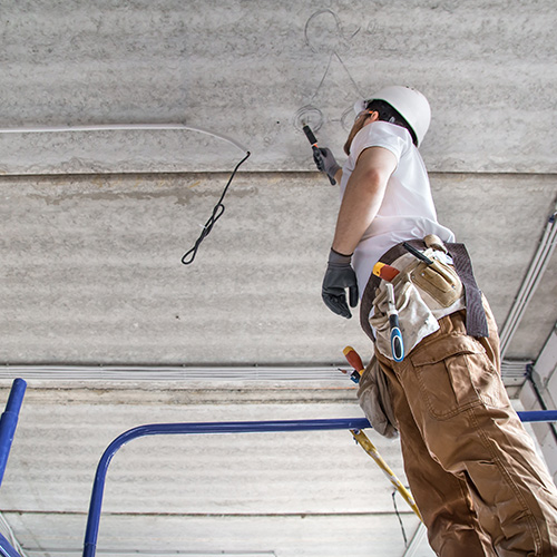 Commercial electrician working on electrical infrastructure