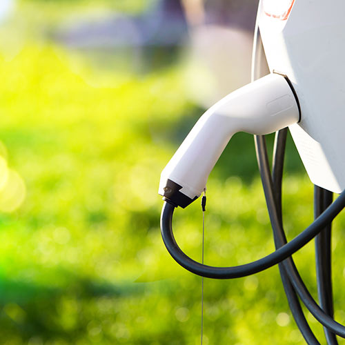 Electric vehicle charger connected to a charging point
